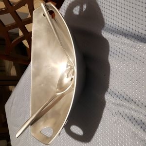 New salad bowl with serving utensils